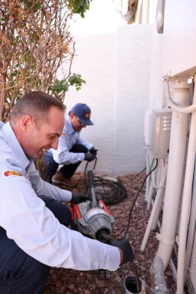Smiling John’s cleaning sewer drain in Chandler