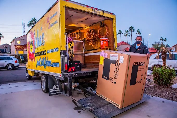 A John’s technician unloading equipment to do a new AC system installation in Chandler.